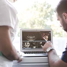 Dentist reviewing X-rays before placement of dental implants in Houston