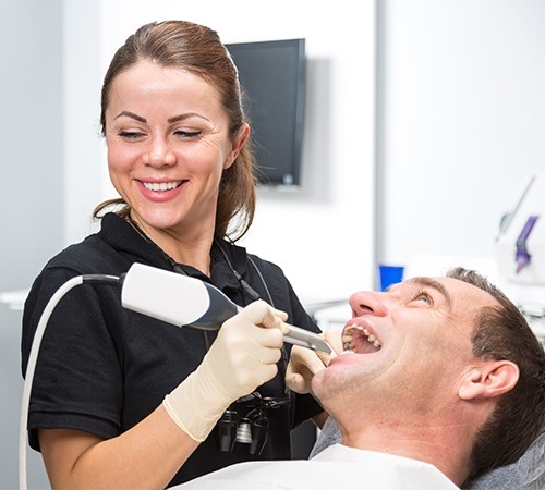 Team member capturing intraoral images